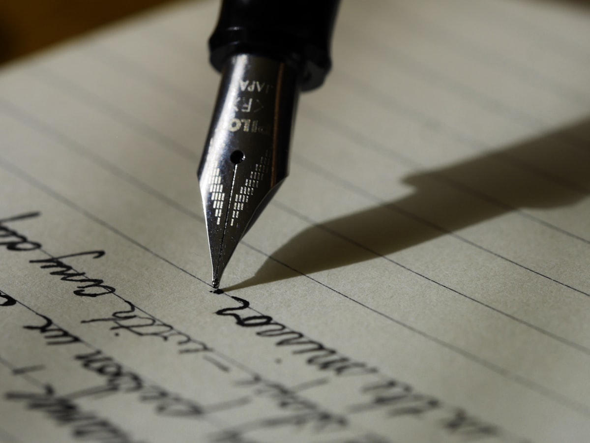 Fountain pen writing on a notebook